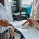 People discussing a paper